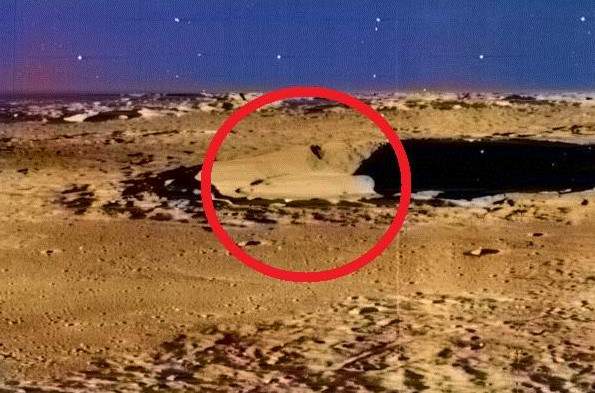 Conspiracy theorist George Graham uploads a new video showing a saucer-shaped structure in a lunar crater