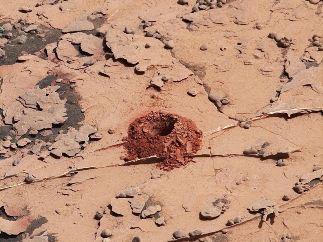 Curiosity dugs a 2-inch-deep hole with its new drilling technique